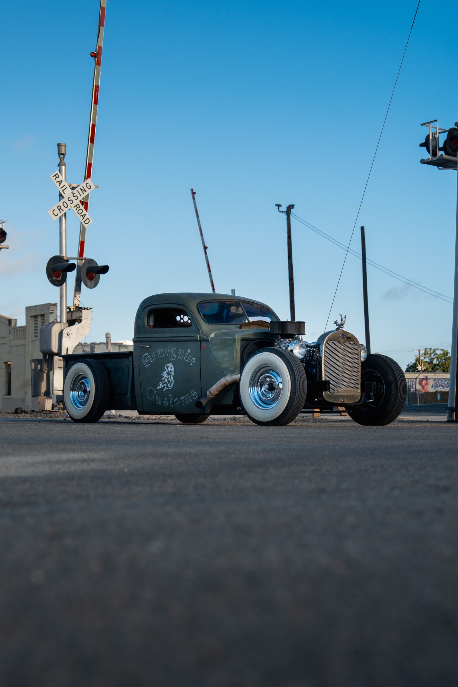 Rat rod at railroad crossing